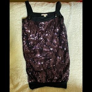 Small purple sequin mini-dress with black straps.